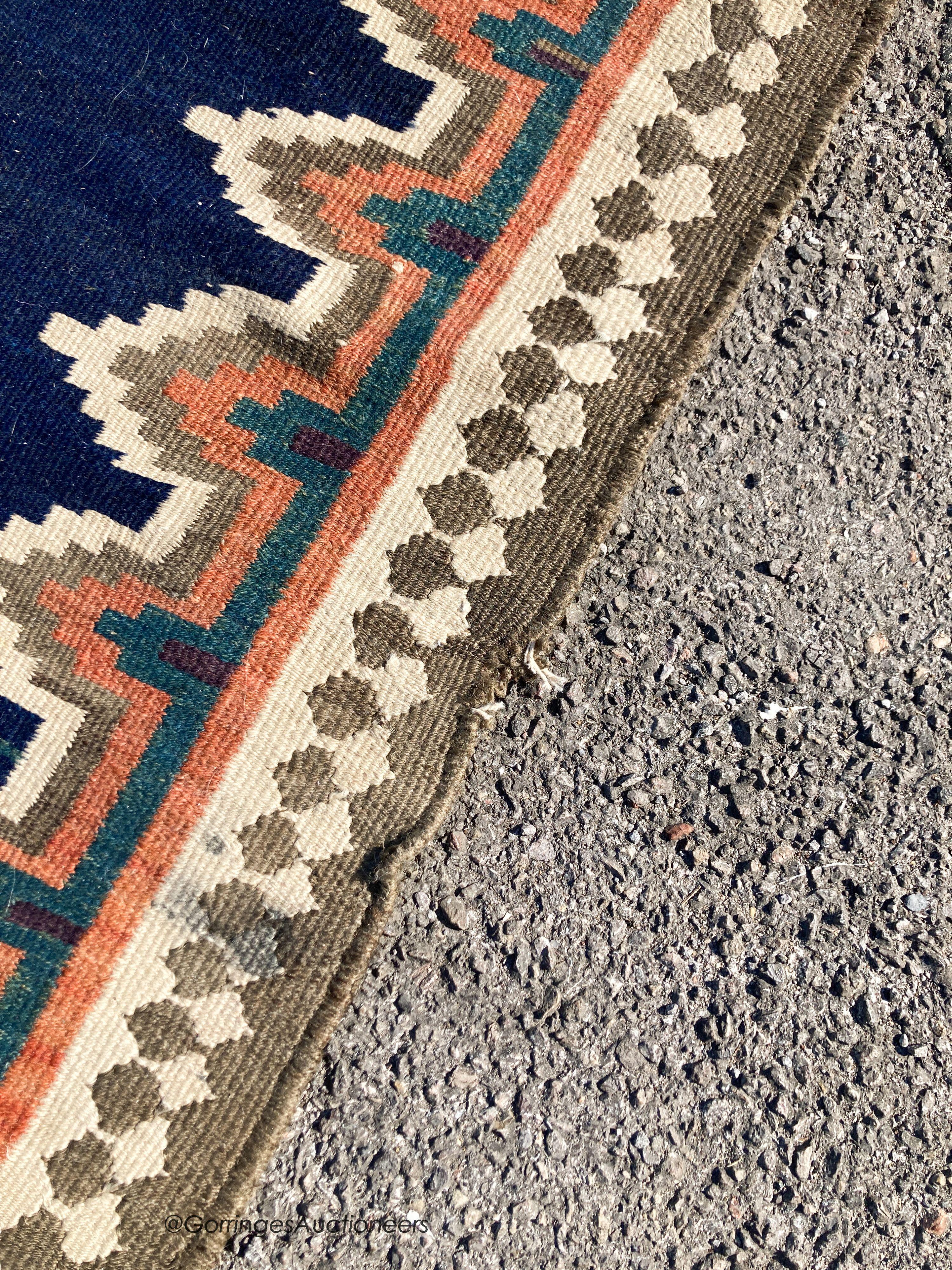 A long Eastern flatweave Kelim runner, 540 x 108cm